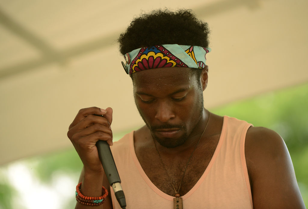Vocalist Josh Runnels, also known by his stage name J.Artiz, performs a song